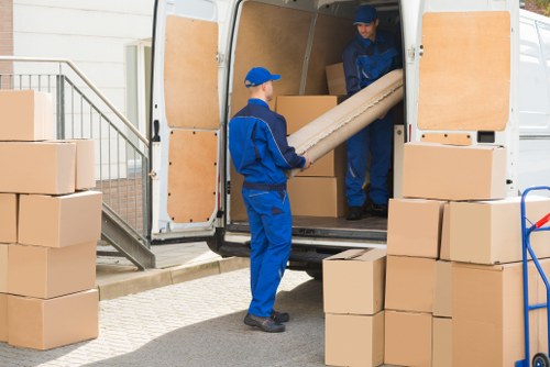 Moving boxes and furniture prepared for a West Hampstead removal