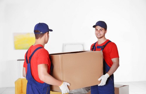 Removal team loading household items for a UK moving service