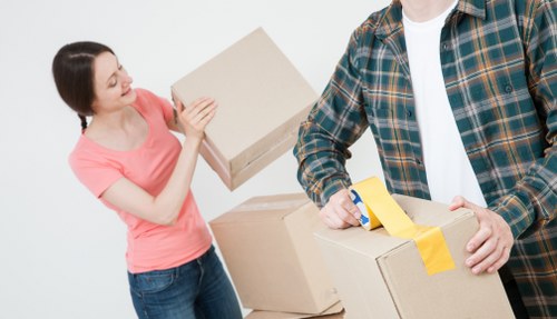 Packed boxes and furniture prepared for a removals booking