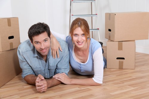 Packed moving boxes and furniture ready for collection in West Hampstead