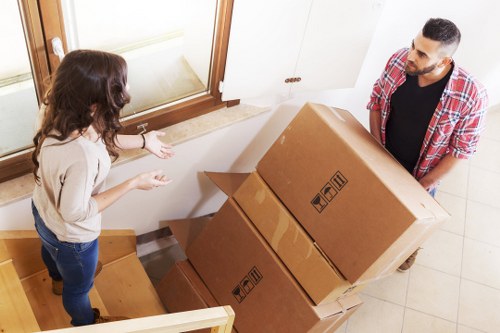 Packed boxes and furniture ready for removal in a Westhampstead home move