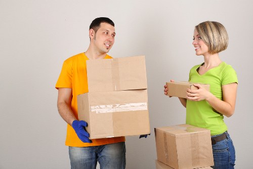 Staff planning a safe moving route with packed items